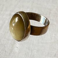 Front angle showing cat's eye stone and bezel setting