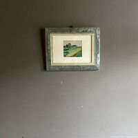 Framed miniature painting on wall