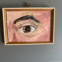 Front view of framed eye study painting