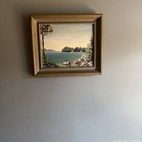 Full view of framed oil painting hanging on wall