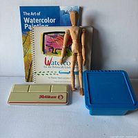 Group shot showing books, manikin, brush bin, Pelikan tin
