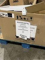 Pallet with Boston Metal box containing white metal table legs, bases, connectors