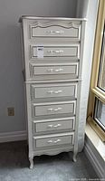Front view of white 7-drawer lingerie chest