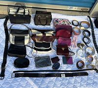 All purses, belts and accessories laid out