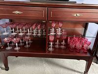 Cabinet view showing all ruby red cut to clear stemware and tumblers