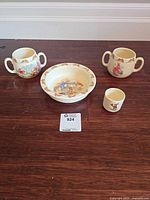 All four Bunnykins pieces arranged on table