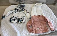 Three jackets laid out showing overall style and colours