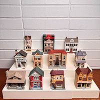 All eleven building ornaments displayed, boxed piece visible