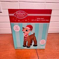 Front of sealed box showing Rudolph inflatable image and branding