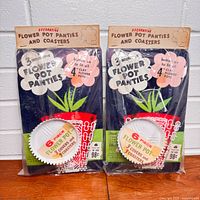 Two sealed packages front view showing product name and graphics