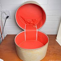 hat box open showing exterior and interior