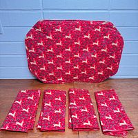 one placemat front with four folded napkins