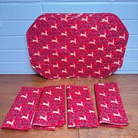 Placemat and four folded napkins showing front patterned side
