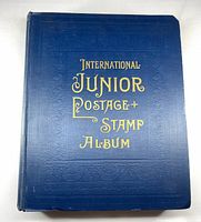 Front cover of blue International Junior Postage Stamp Album