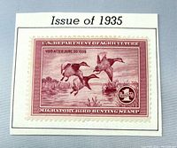 Front view of 1935 $1 duck stamp on album page cutout