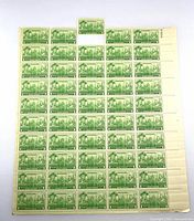 Front of stamp sheet with loose stamp