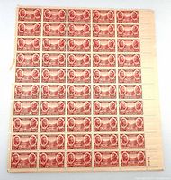 Front view of full stamp sheet showing design, perforations and selvage with plate number