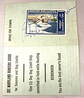 Front of folded Maryland hunting license showing affixed 1967 $3 Migratory Bird Hunting stamp with signature