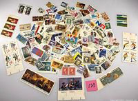 Overhead view of entire scattered group of mint US stamps