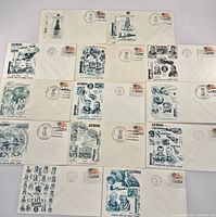 Fourteen Gemini FDC envelopes front view displaying cachets, stamps, cancellations