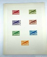 Full album sheet showing all seven stamps mounted