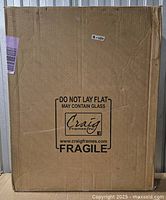 Front of sealed Craig Frames shipping box marked fragile, contains picture frame