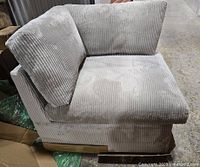 Front angle of grey corduroy corner sofa seat showing side and back cushions