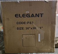 Sealed box labeled 'ELEGANT' code P83 size 36" x 36" containing shower pan