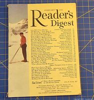 Front cover displaying title, date, contents list, skier illustration