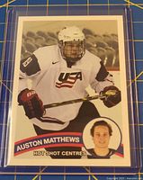 Front of Auston Matthews Hot Shot Centres trading card in protective sleeve