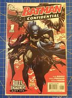 Front cover of Batman Confidential Issue 1 comic book in protective sleeve