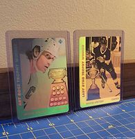 Front view of both Upper Deck Wayne Gretzky hologram cards in sleeves