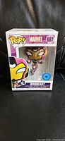 Front view of boxed Funko Pop! Ironheart #687 showing exclusive sticker