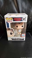 Front view of boxed Funko Pop Eleven #523