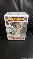 Front of boxed Funko Pop Peacemaker #1233