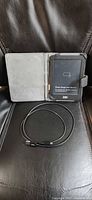 Kobo eReader open in folio cover with USB cable
