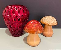 Group shot of red cut-to-clear vase with two mushroom figurines
