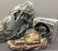 All three stone sculptures grouped