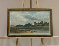 Full view of framed watercolor on easel