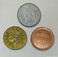 Obverse of all three coins showing dates and designs