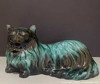 Front three-quarter view of Blue Mountain Pottery reclining cat showing glaze coloration and form