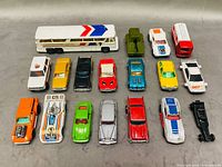 Full group of 16 vehicles arranged in four rows