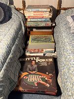 Stacked view showing Go to the Head of the Class, Broadside, Skirmish, Battleship, Connect Four, Carry-All Action Fighting Knights, Racerific Camaro, Skittle Poker