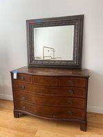 Front view of dresser with mirror displayed on top