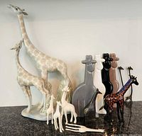 Entire group showing large porcelain pair, stylized ceramics, cloisonné giraffe, brass piece, miniatures and utensils