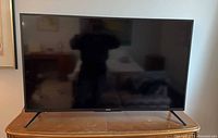 Front view of Sharp 50" LED HDTV on stand