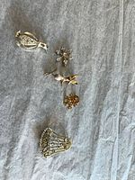 Group shot of five brooches