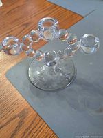 Full view showing three candle cups and beaded arm