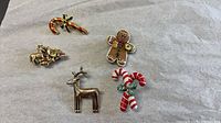Group shot of all five Christmas brooches
