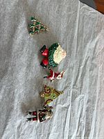 Group of four brooches showing overall variety